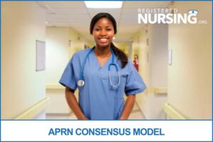 An APRN stands in the hallway of a hospital.